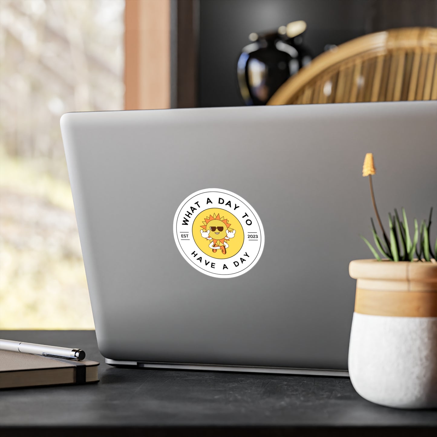Circle vinyl decal sticker. What a Day to Have a Day, EST 2023, with animated sun in sunglasses. Laptop mock up.